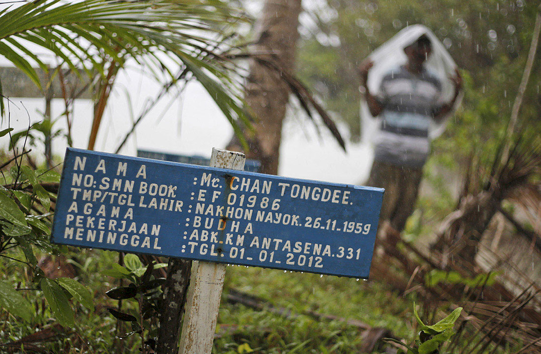 GRAVEYARD: A jungle graveyard entombs dozens of fishermen, buried under fake names – leaving them invisible, even in death. (AP Photo/Dita Alangkara)